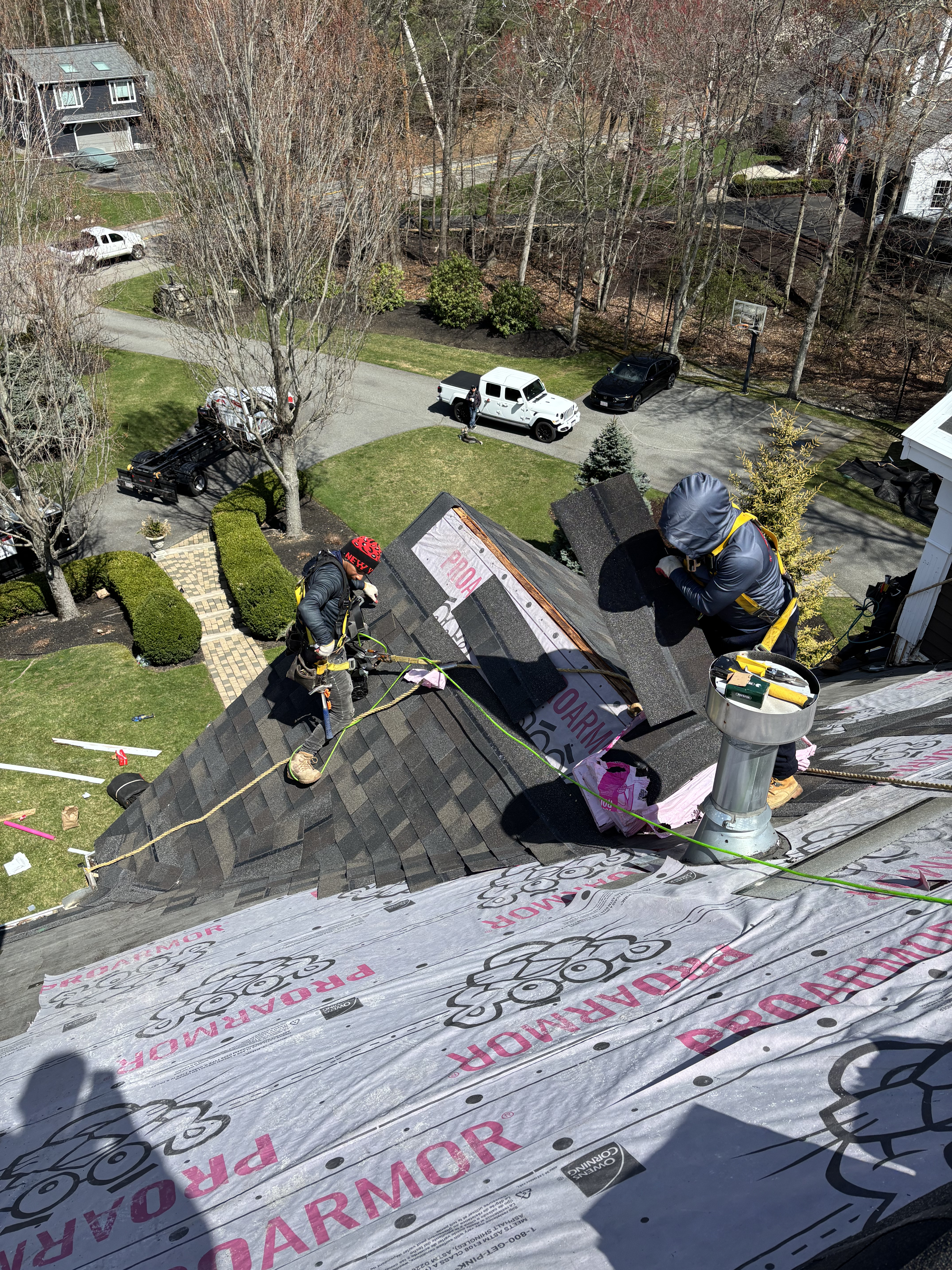 Universal Roofing Solutions team and trucks